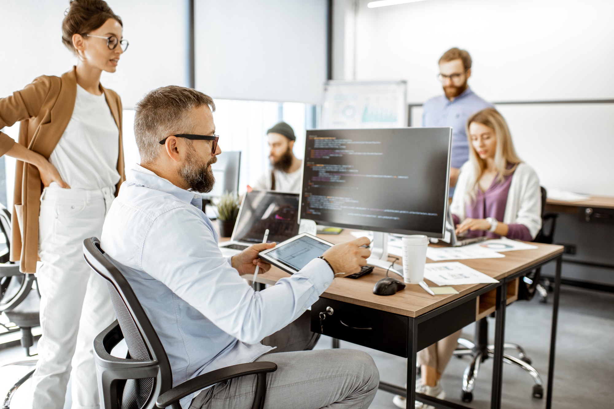 Outsource Your Marketing: The Ultimate Guide for Business Growth programmers working at the office