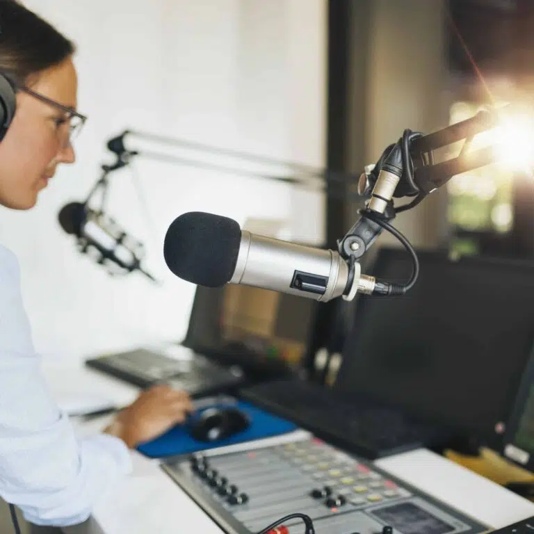 Content Creation & Content Marketing microphone in a podcasting studio host and the broadcasting equipment in the background