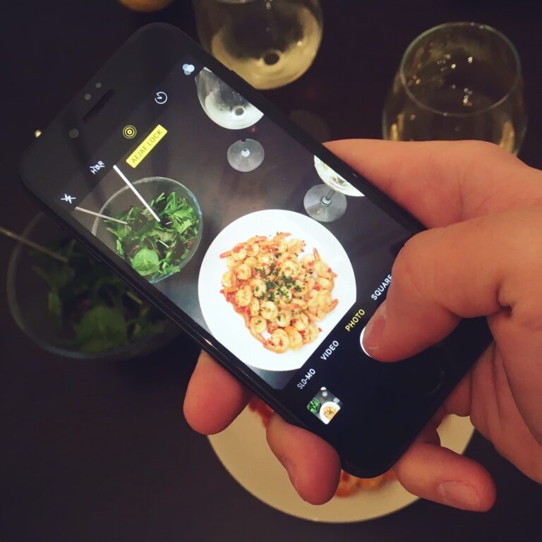Social Media Marketing using phone to photograph food