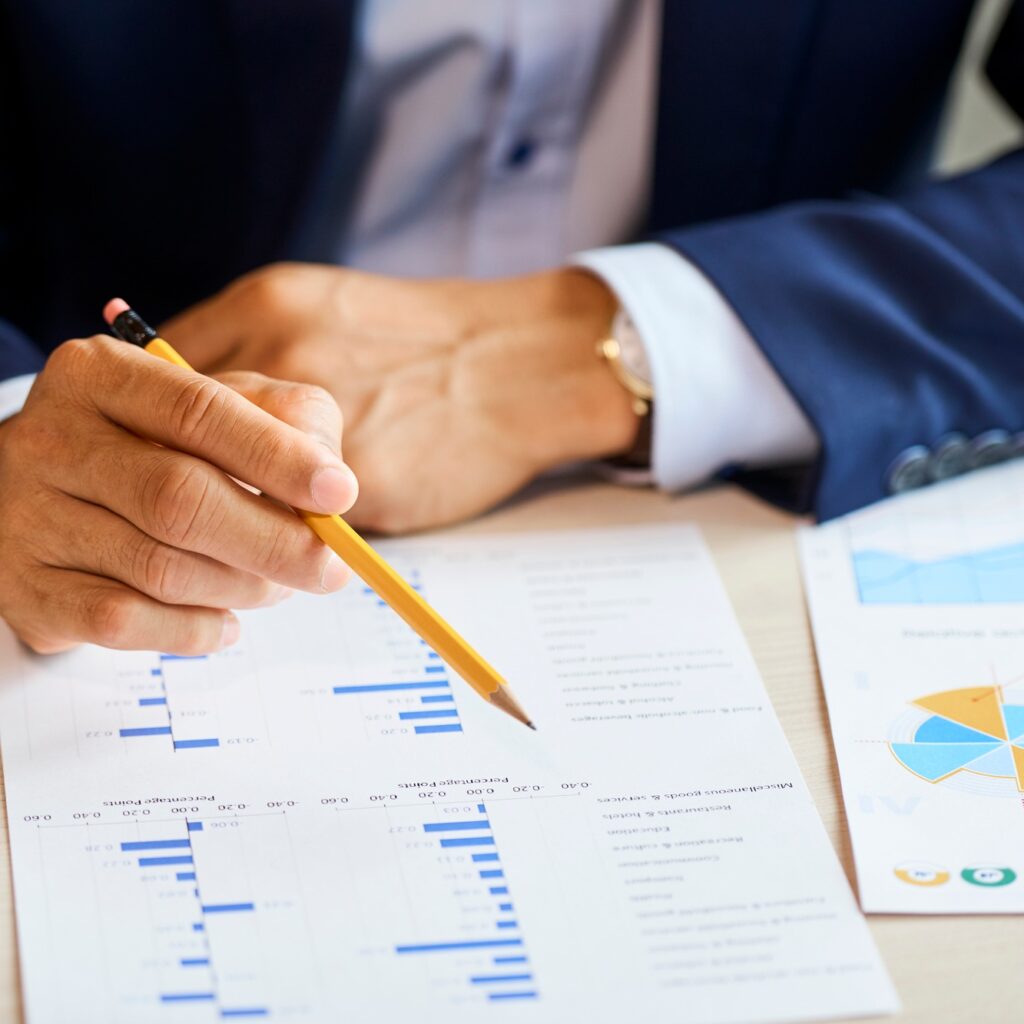 Businessman with pencil checking chart