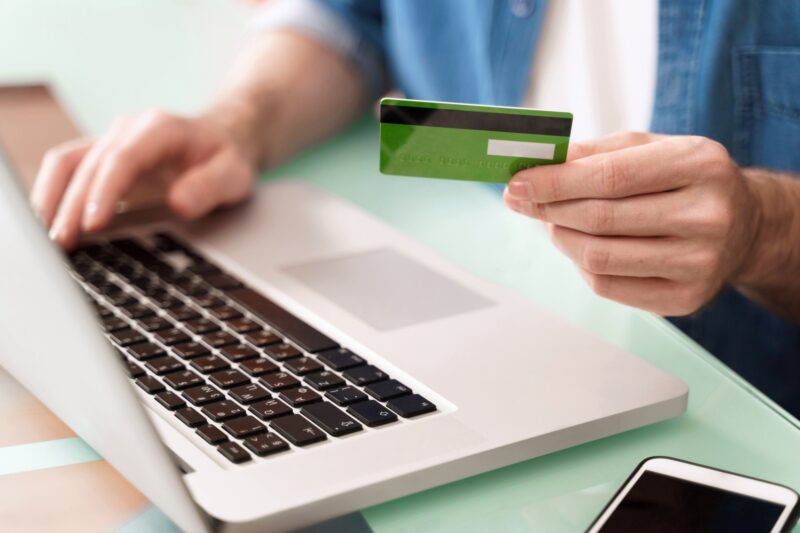 Caucasian man buying on the web and paying by card