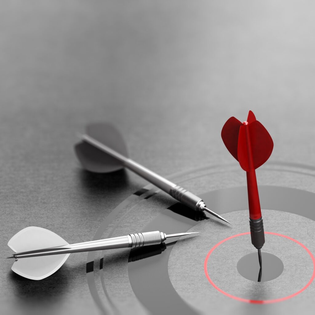 Successful Business Concept, Red Dart Reaching Center of a Target.